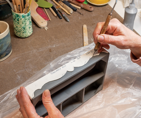 13 Trace a design onto one long side, cut off the profile, and use it as a guide to trace the design on the opposite side.
