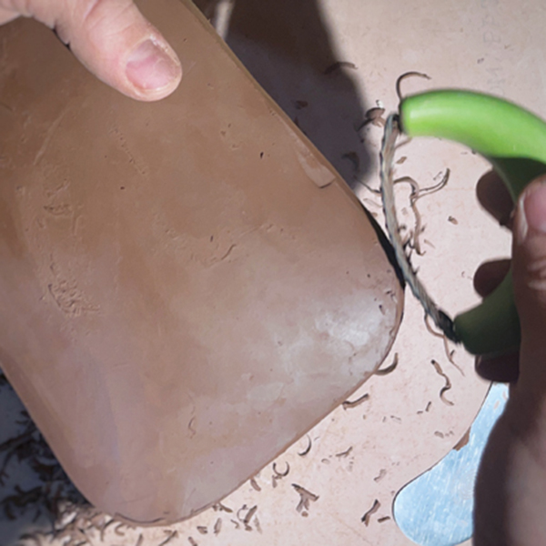 13 Use a Surform to shape and shave down the sides of the lid and adjust the fit to the box. 