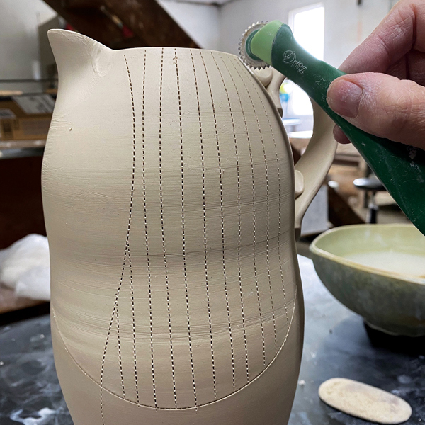 14 Before slip trailing the dots, draw dotted lines on the surface as guides to follow using a tracing wheel.