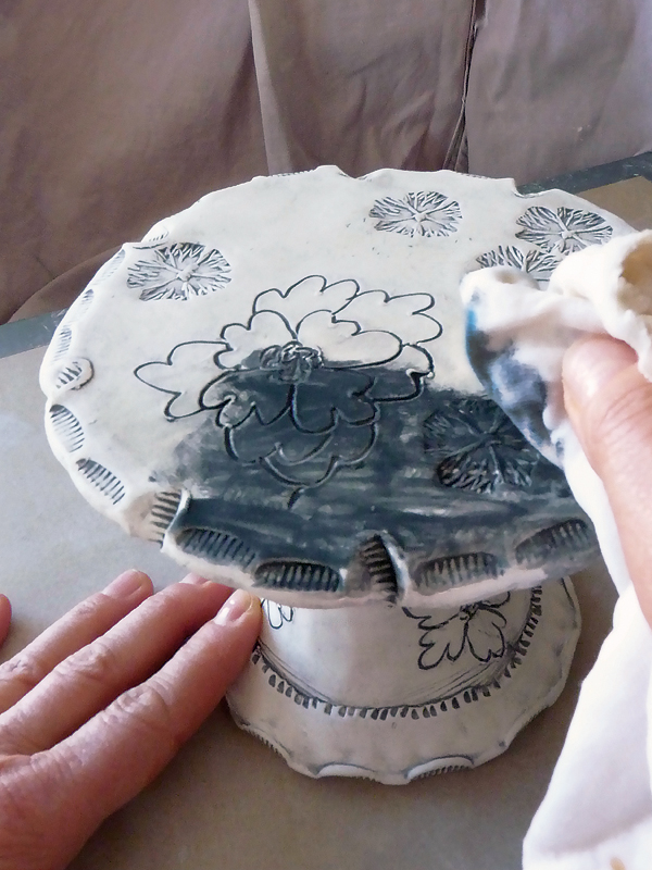 14 Apply, then remove excess underglaze using an oxford cloth.