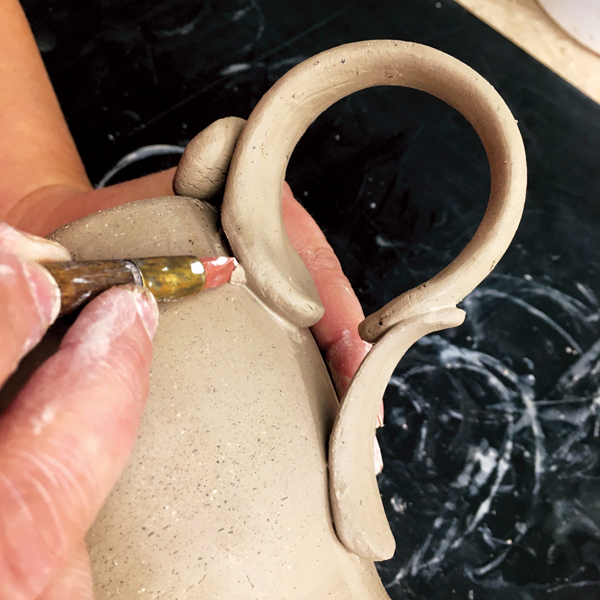 14 Use a rubber-tipped tool to clean up and refine the areas of attachment.
