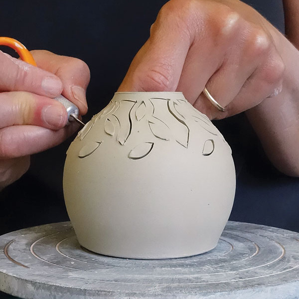 15 Cut leaves, then vines and stems, then more leaves, moving from top to base.