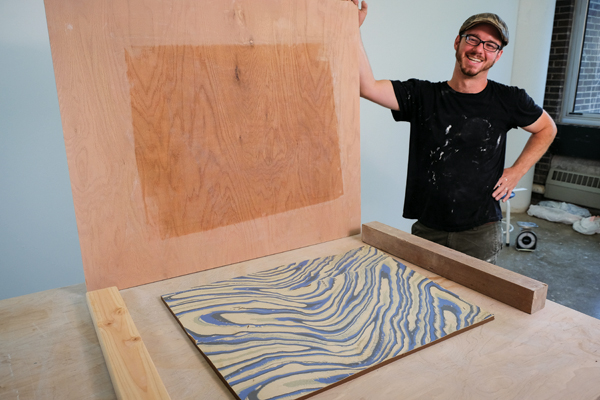 After cutting the combined stoneware and porcelain slab to size, it is flipped over onto a new ware board, revealing the surface pattern.