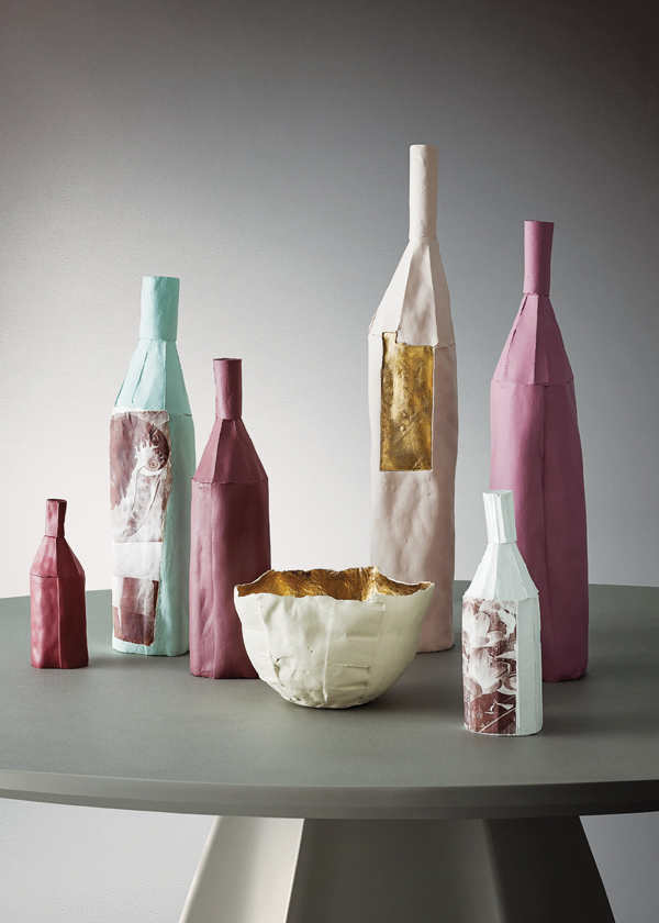 4 Bottles and bowl, to 27½ in. (70 cm) in height, paper clay, gold luster, printed decals, 2019. 