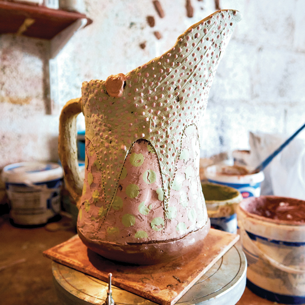 20 Add dots of slip with a precision-tip slip- trailing bottle to sections of the main body of the jug.