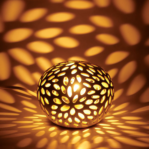 Nightlight, 3¾ in. (10 cm) in height, wheel-thrown and pierced white stoneware with glaze, fired to cone 6 in oxidation, 2021. 
