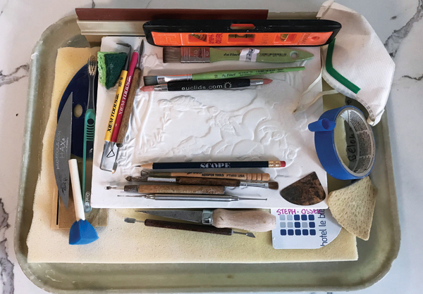 D Assortment of tools for carving, scraping, and leveling. 