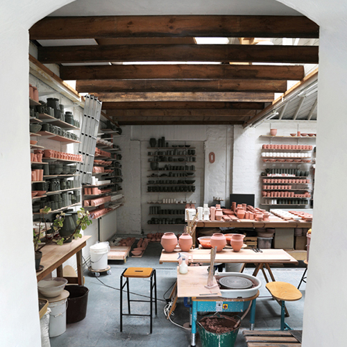 The shelves in Florian Gadsby’s studio filled with pots