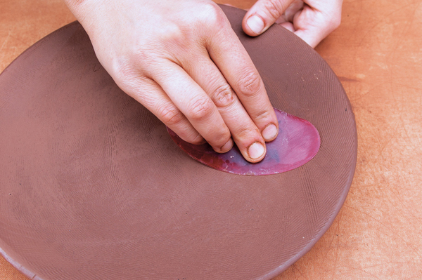 4 Use your hand to remove any burrs and a soft rib to smooth the texture.