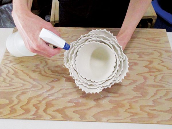 13 Intermittently mist the clay with water to maintain a workable consistency.