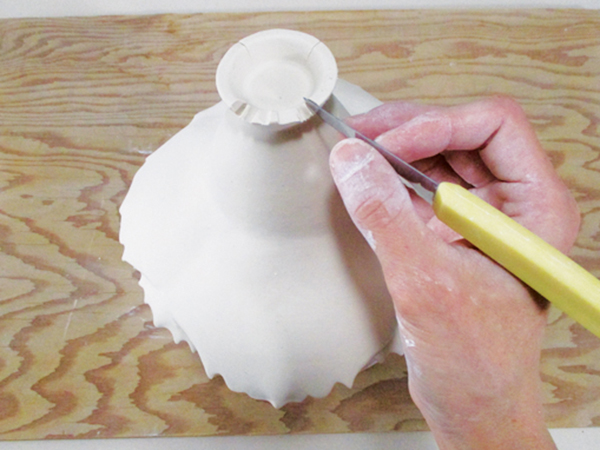15 Cut the foot and add layers to mirror the shape of the rim.