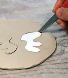 6 Draw a pattern for the tail on paper and cut it out. Use the pattern to cut out both sides of the tail.