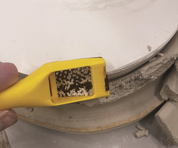 5 Remove sharp edges with a rasp and allow mold to dry completely.