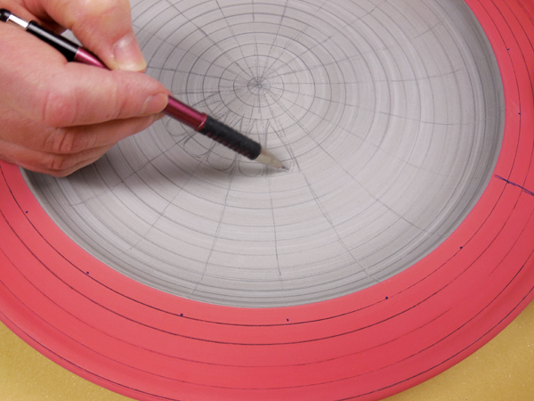 5 Draw all dividing lines with a pencil, deciding on placement of teardrops and larger dotted areas.