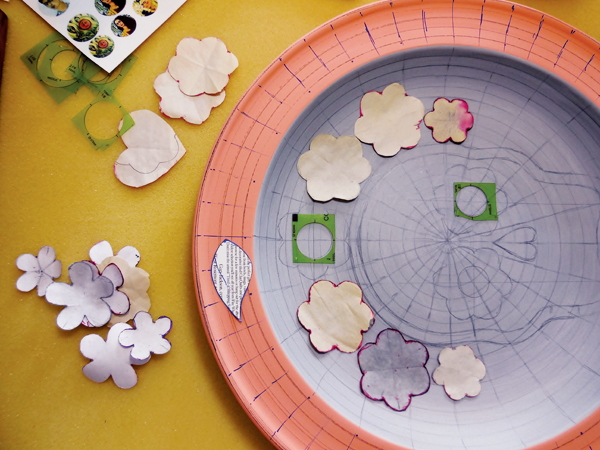 11 Draw a skull using templates and circles. Use additional paper templates to further embellish and layer the pattern.