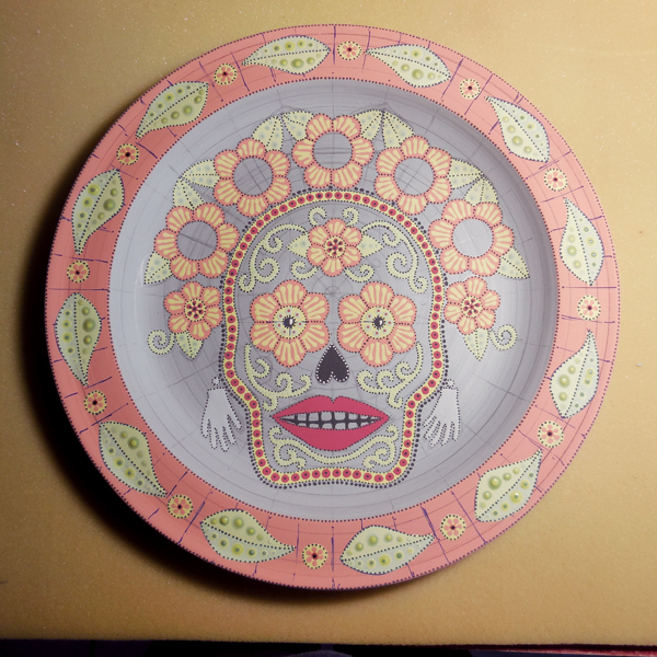 13 An underglazed bone-dry skull platter, ready to be bisque fired. Pencil and marker lines will burn out in the firing.