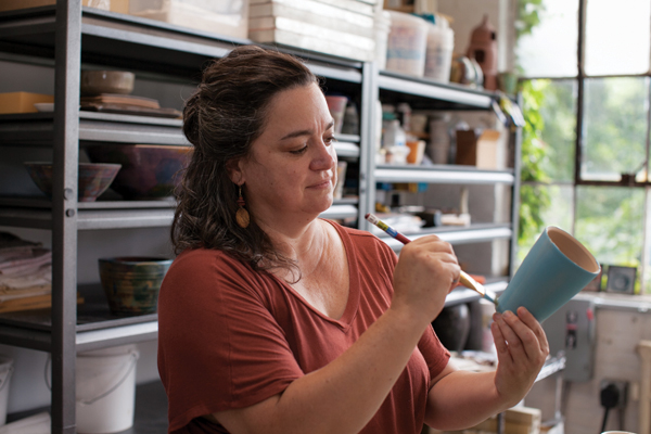 1 Lex Feldheim at work at Kingston Ceramics Studio. 