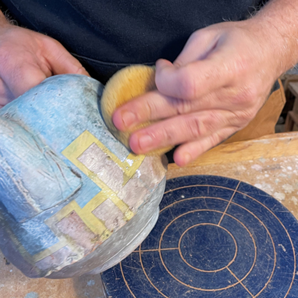 4 Wipe the excess wash off with a sponge, ringing out the sponge each time you wipe away a section.