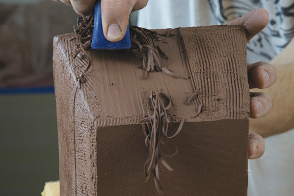 13 Next, begin carving the box using a Surform.