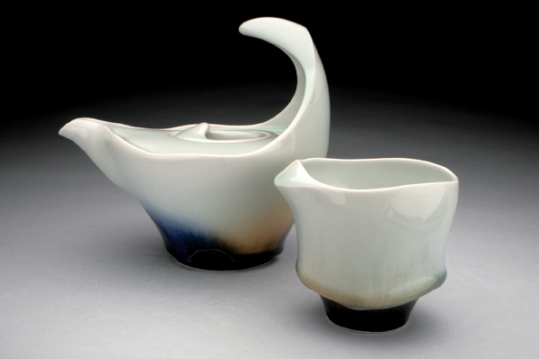 19 Noel Bailey‘s Wave Teapot with Cornice Cup, to 7½ in. (19 cm) in height, porcelain, fired to cone 10 in reduction, 2022.
