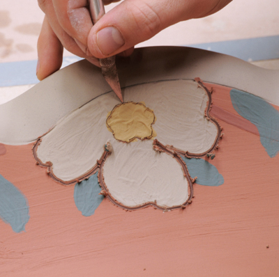 9 Achieve a thicker sgraffito line on softer clay with a dull pencil, and a thinner sgraffito line on harder clay with a needle tool.