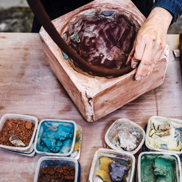 10 Mix the commercial black clay with a rich, iron-red clay to create a blue-black clay body, then add a coil of blue-black clay to the rim of the vessel in the mold.