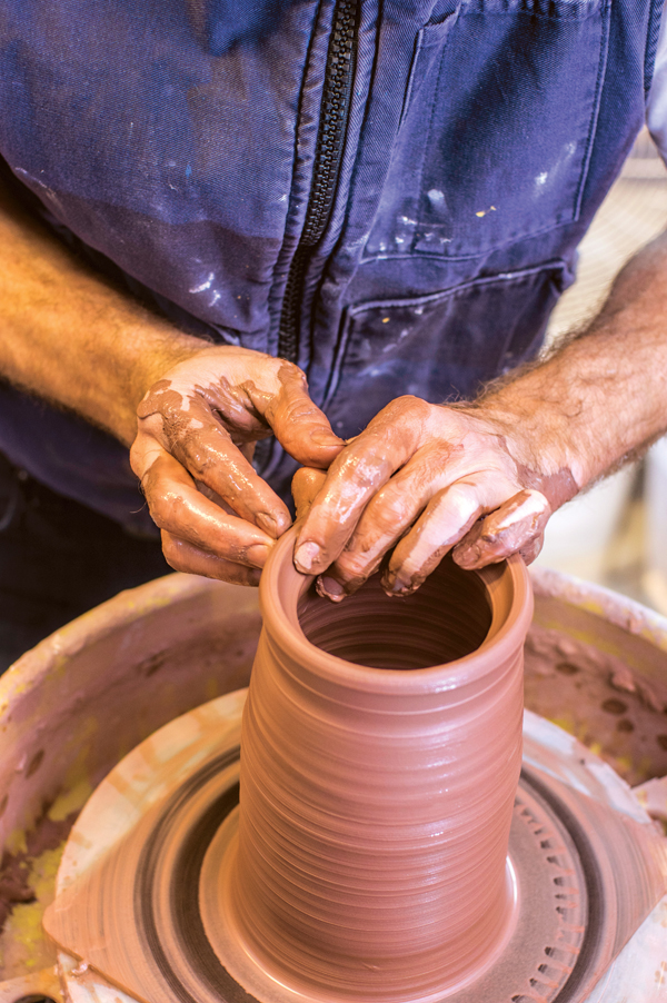 1 Throw a cylinder with a thick rim and use your fingers to create a gallery.