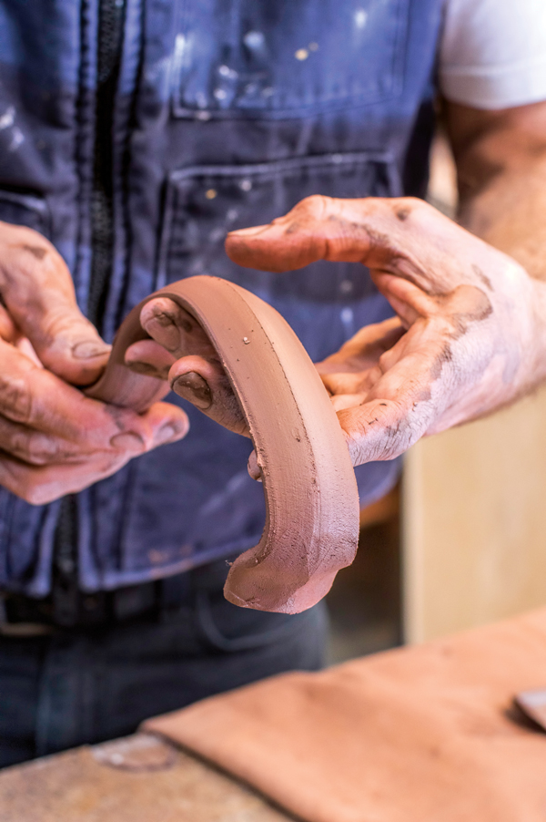 5 Pull a handle and let it set up before shaping it.