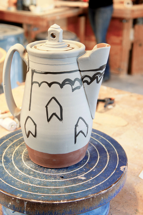 9 Once the shapes have been determined, use a sharp needle tool to draw into the clay.