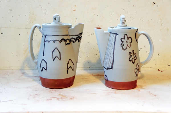 11 Two lidded pitchers ready to load into the bisque kiln.