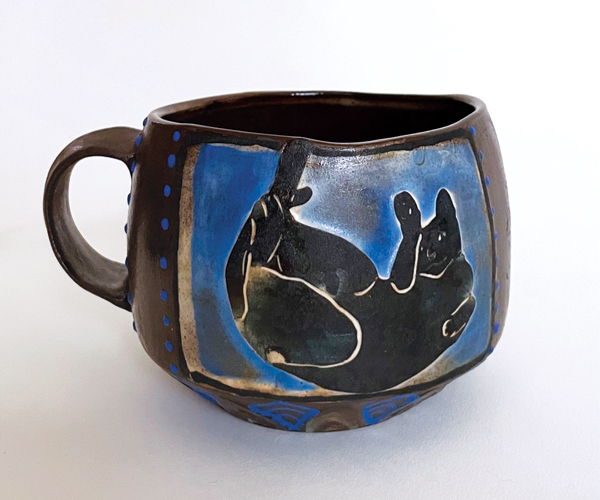 8 Ishara Sweeney’s Clea, 3¼ in. (8.3 cm) in height, wheel-thrown ceramic, water etching, underglaze painting, glazed interior, soda wash, ﬁred to cone 5 in reduction, 2021. 