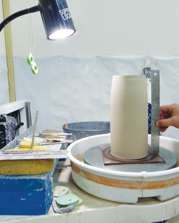 1 To form the growler body, throw a 12-inch-high cylinder on a bat.