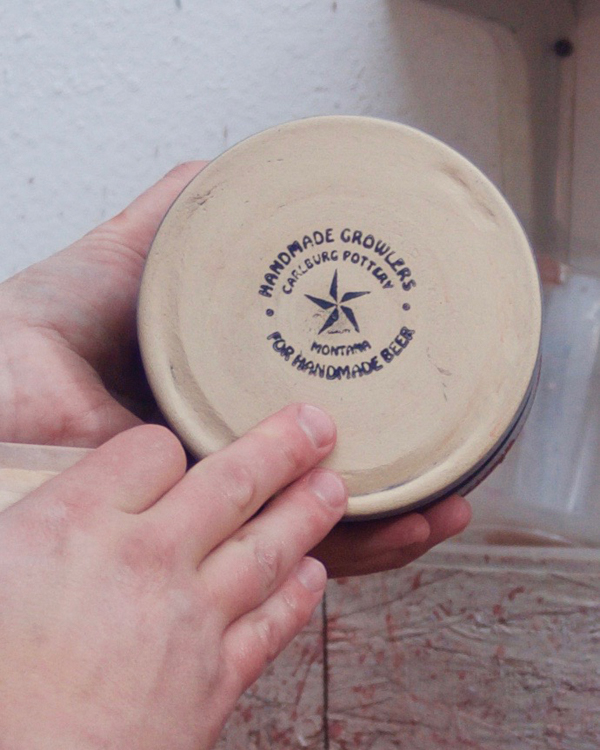 19 Wipe off the bottom with a sponge. I add my maker’s mark using a wood-block rubber stamp coated with black underglaze. Fired the piece in an electric kiln to cone 6.