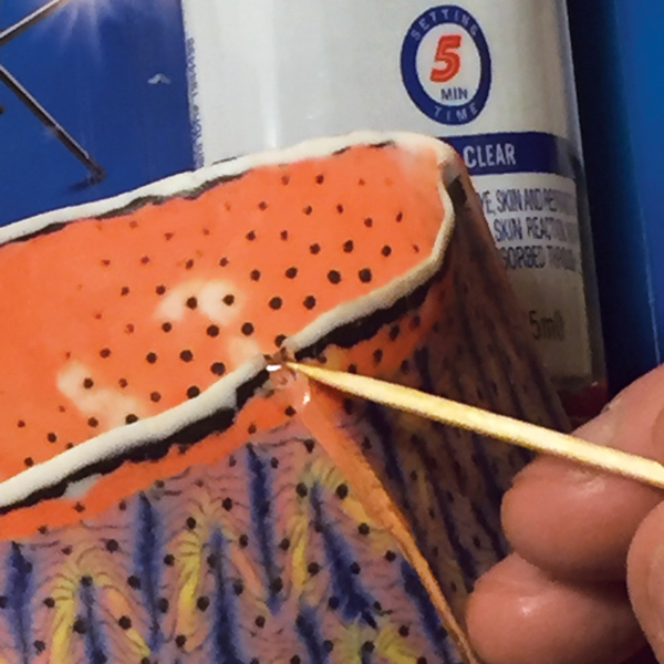 1 Mix a five-minute epoxy, then apply it to the crack with a toothpick. 