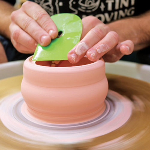 1 Use the 90° angle on a firm rib to split the thick rim and create a lid seat.