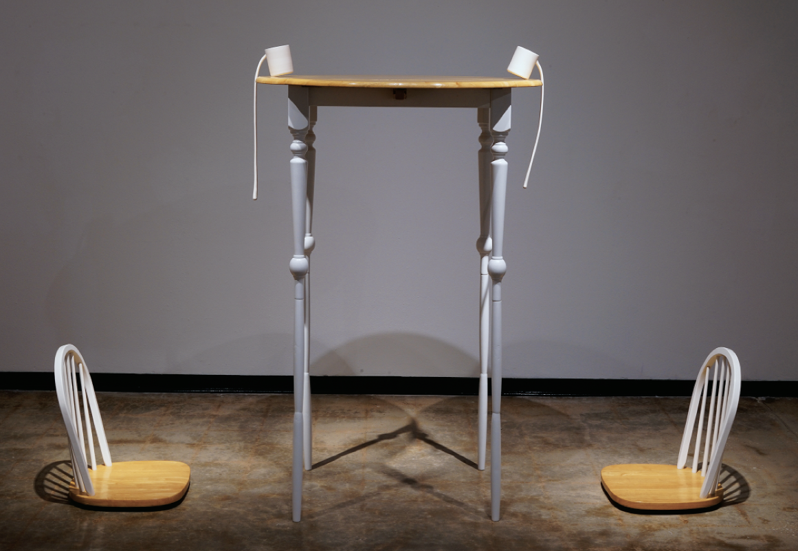 17 Claire Lenahan’s Precarious, wheel-thrown porcelain, fired to cone 6 in oxidation, found-and-altered wood table and chairs, 2021.