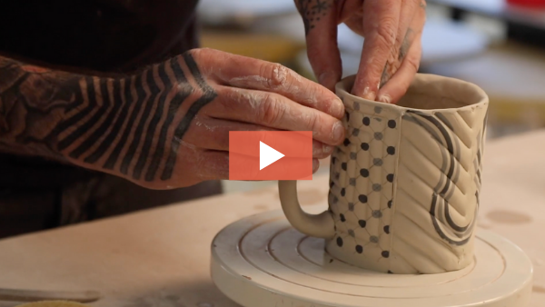 Still from video of Blair Clemo attaching a handle for a mug.