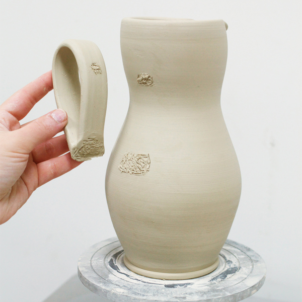 5 Trace and score the attachment points on the handle and pitcher, then apply slip and join the two.