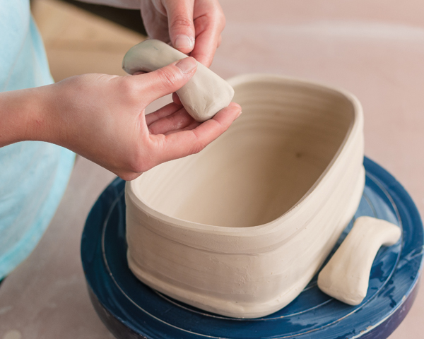 10 Pinch two handles for the narrow sides of the basket and allow them to reach leather hard.