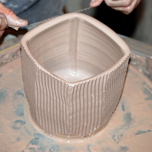 7 Cut the form from top to bottom with the curled wire. Wider panels are possible if the form is squared before faceting.
