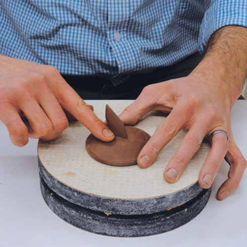 5 Throw a shallow bowl for the lid. Measure it for fit. Trim the infuser and the lid and check for fit, then add a handle.