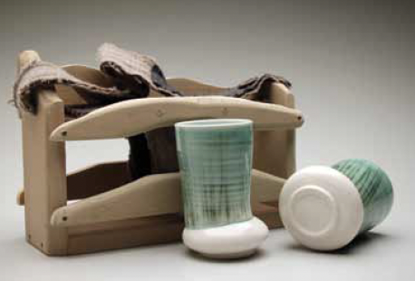 Cups of Conversation : Cups and Carrier, 12 in. (30 cm) in length, wheel-thrown and altered porcelain, copper wash, multiple glazes, fired to cone 10 (2345°F) in an electric kiln, wooden carrying case made by Gwen Hageman, 2015–16.