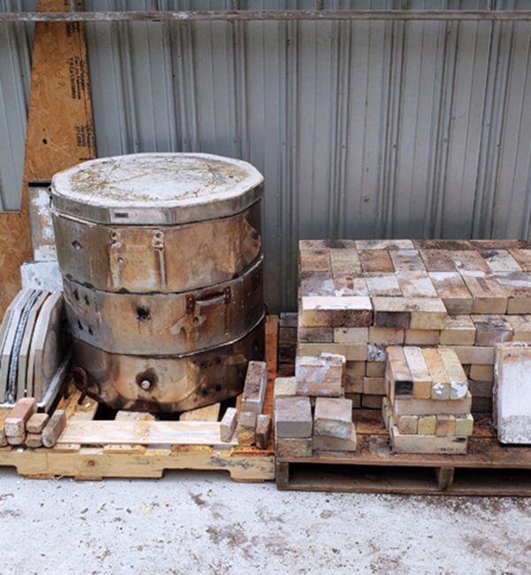2 Recycled materials: used electric kiln, 150 standard-sized used hard bricks, some oddly shaped bricks, cinder blocks, and kiln posts and shelves.