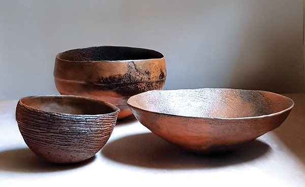 7 Smoke-fired bowls, to 10½ in. (27 cm) in diameter, white stoneware, terra sigillata made from local clay collected by the artist, 2019.