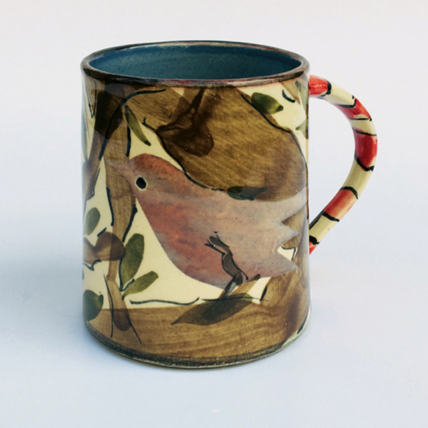 2 Sophie MacCarthy’s mug with birds, tree, and leaves motif, 4¾ in. (12 cm) in length, earthenware, painted slips, stencils, wax resist.