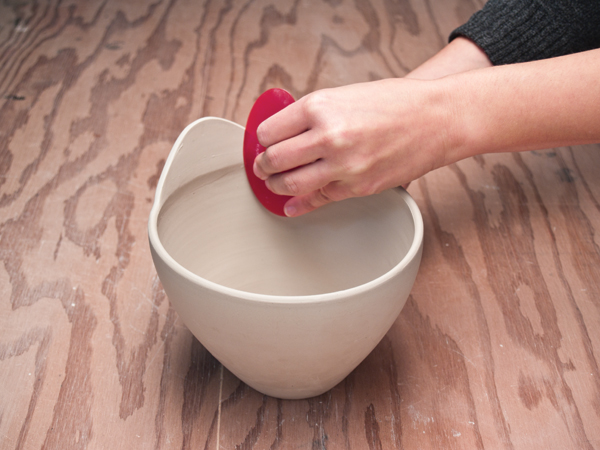 6 Smooth the handle to match the rounded profile of the thrown rim.