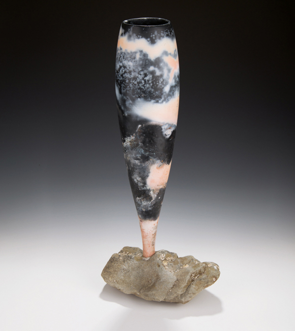 7 Mary Fox’s Chalice Mounted in Rock, 21 in. (54 cm) in height, slip cast, saggar fired with sawdust, seaweed, coal, and copper carbonate to cone 06, Vancouver Island sandstone, 2021.