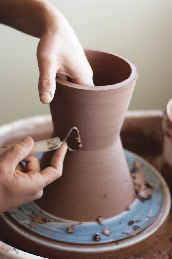 4 When leather hard, lightly trim the pot to pull out the grain of the coarse fireclay and grog.