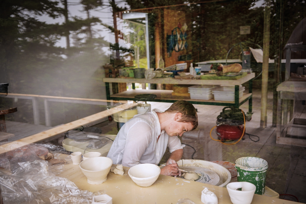 Workshop attendee working on the wheel at the Haystack Mountain School of Crafts. Photo: Dan Rajter.