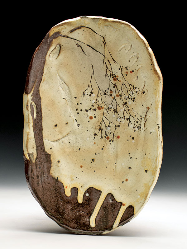 5 Oval plate, 11 in. (28 cm) in length, slab-built stoneware, white slip, clear and multiple colored glazes, reduction fired to cone 10 in a gas kiln. 
